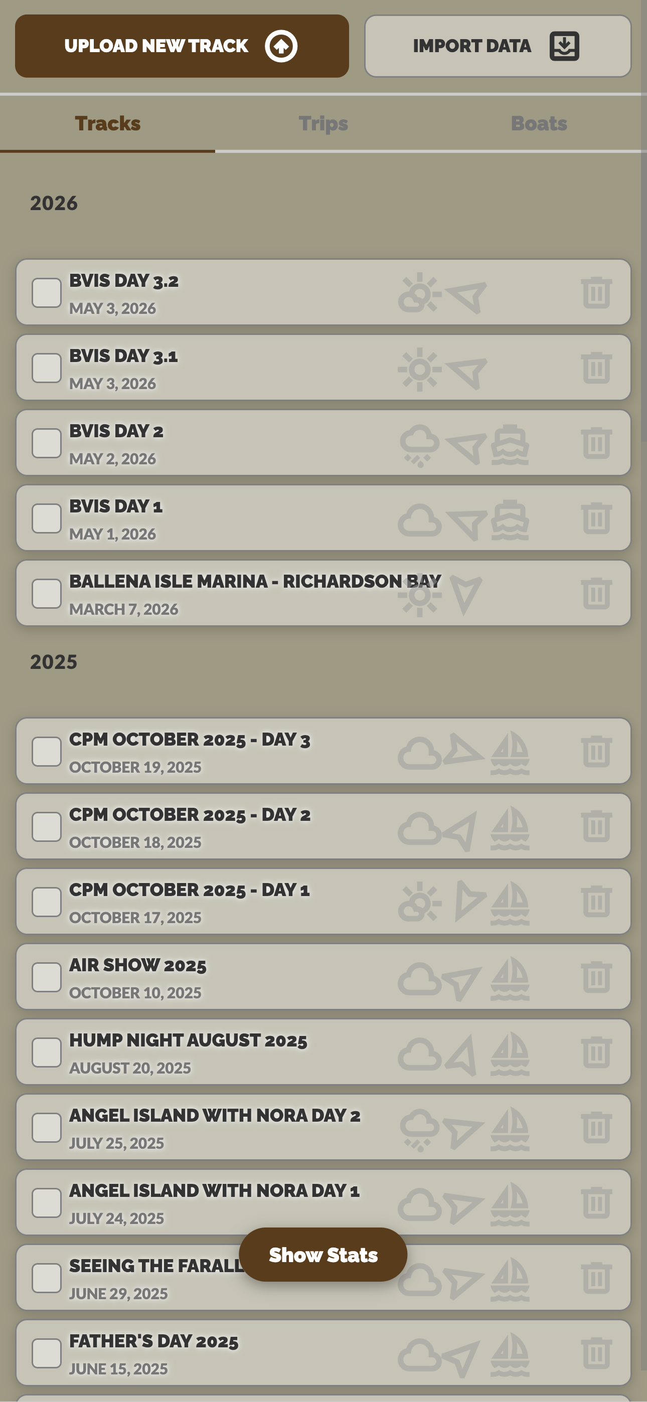 Mobile track list panel showing tracks grouped by year with weather and boat icons